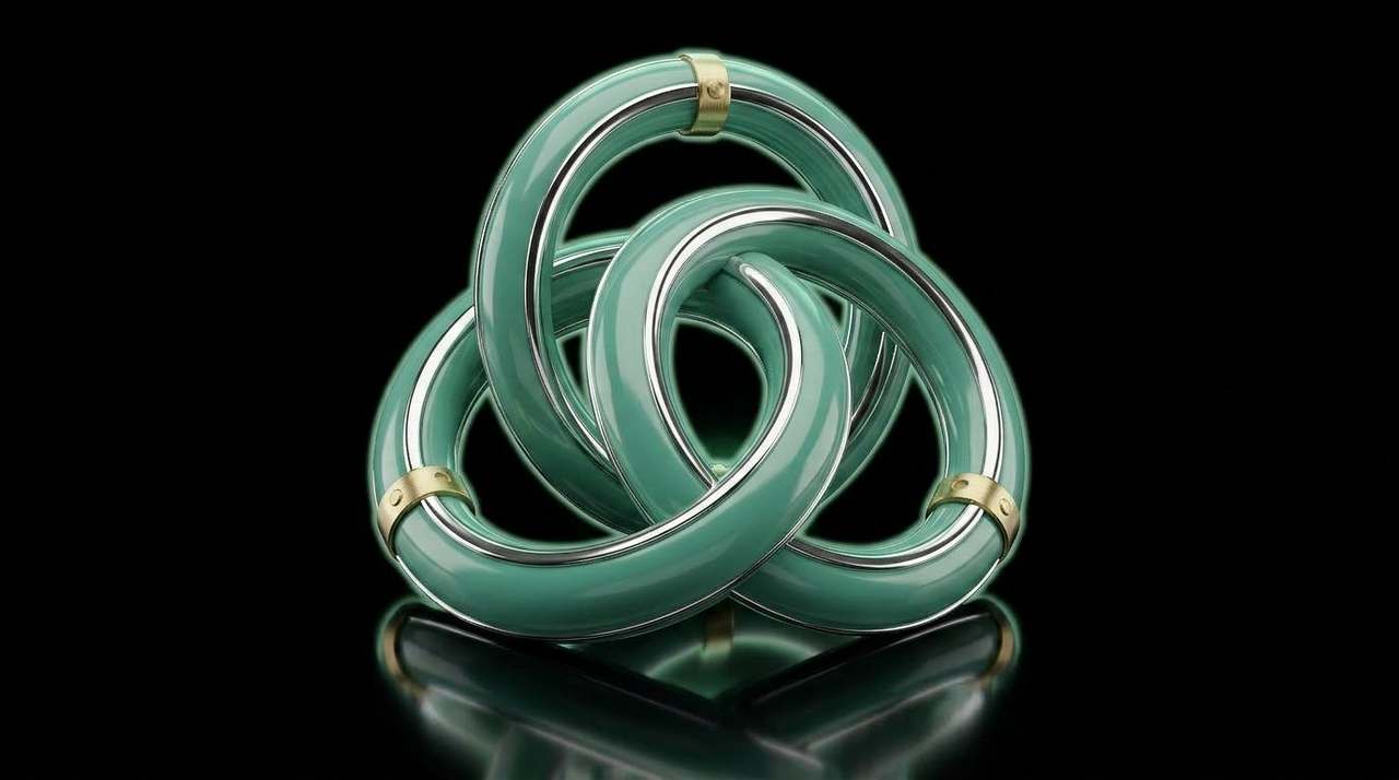 Three interlocking sage-green lacquered rings on a brushed brass pedestal — the product-selection triad.